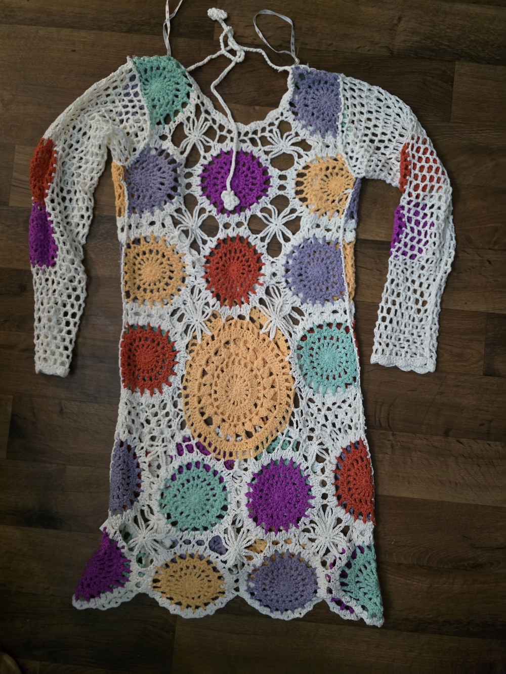 Open-knit crochet base with vibrant, multi-colored circular medallions COVER UP